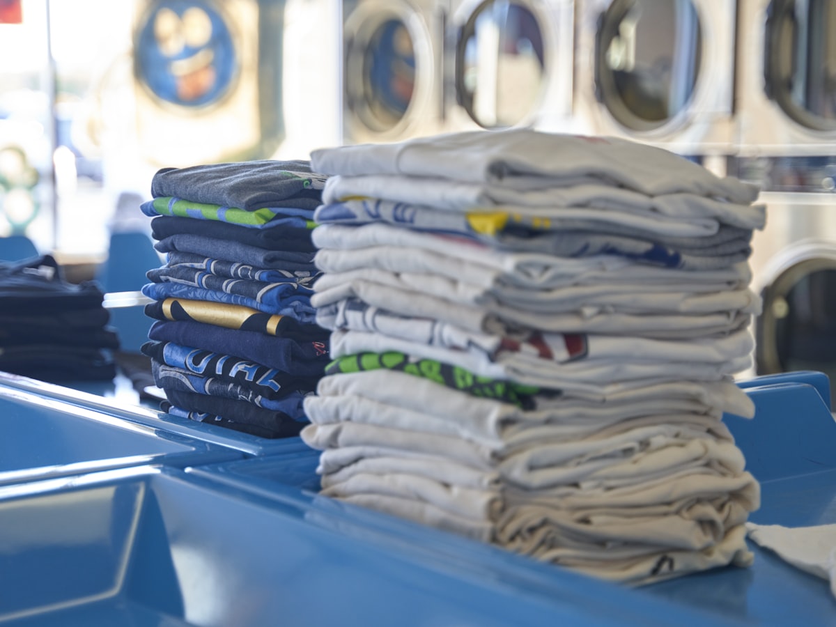 Neat stacks of folded and sorted clothes ready for delivery