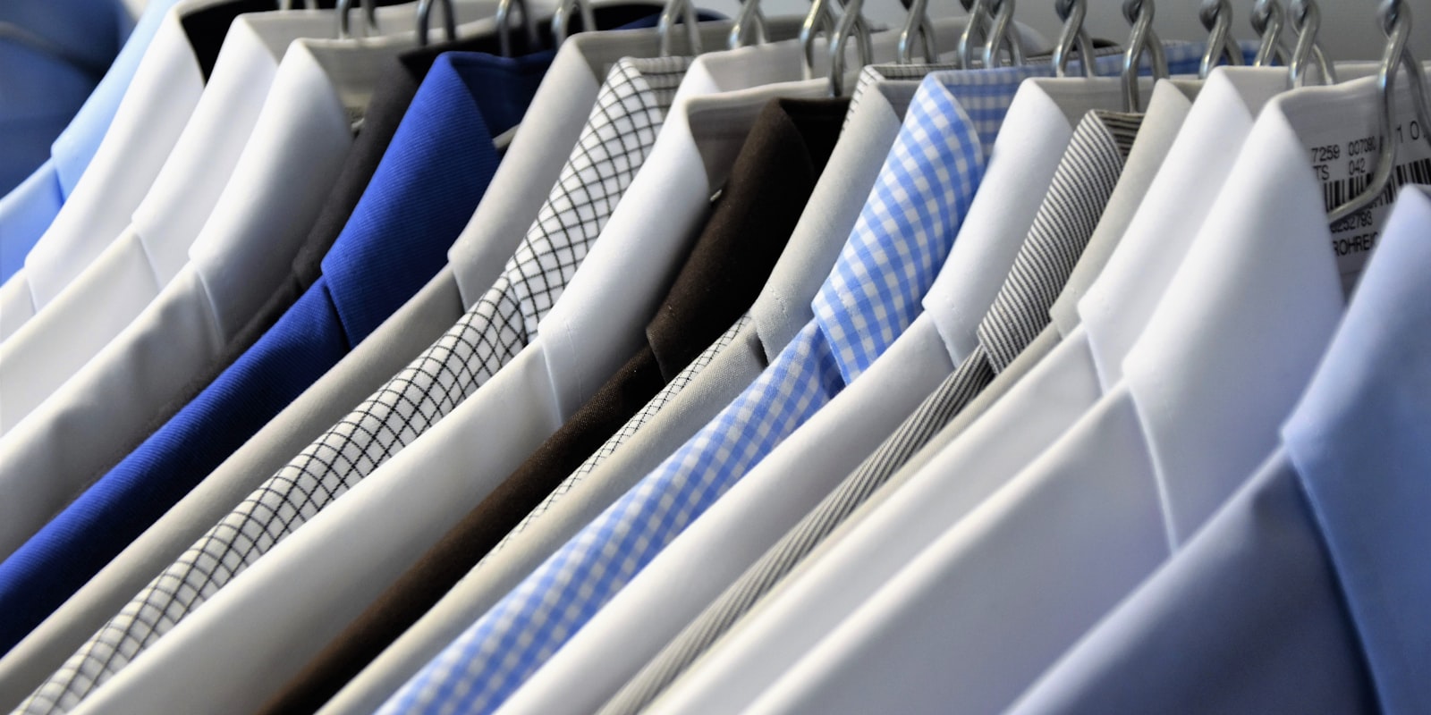A rail of freshly pressed shirts ready for collection